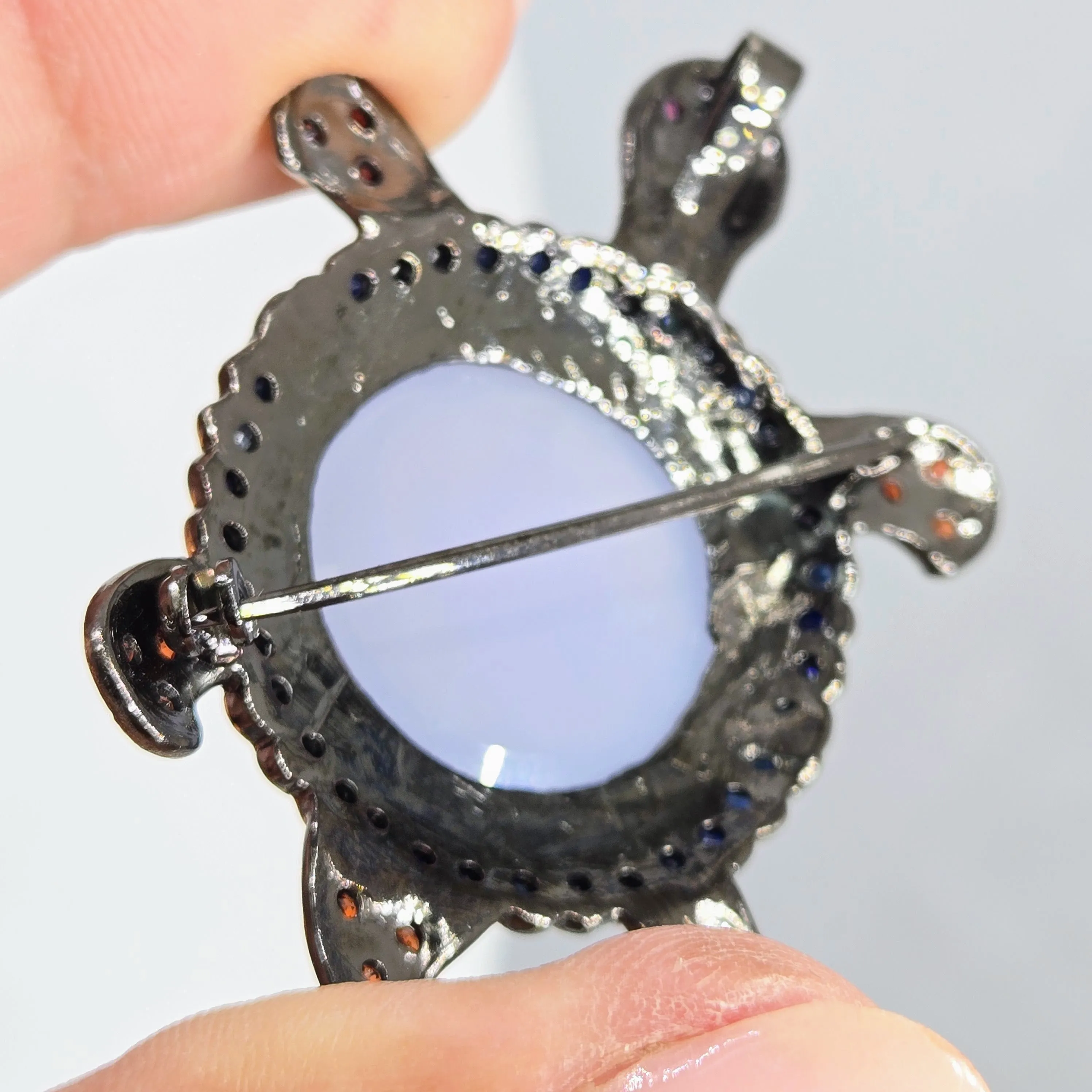 "Starry-Eyed, Flipper-Face!" Pendant/Brooch - Chalcedony, Garnet, Sapphire, Black Sterling, 18k Gold