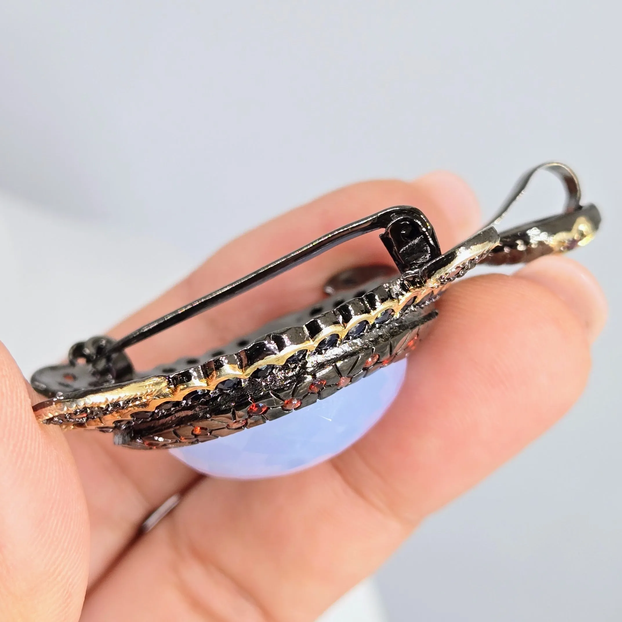 "Starry-Eyed, Flipper-Face!" Pendant/Brooch - Chalcedony, Garnet, Sapphire, Black Sterling, 18k Gold