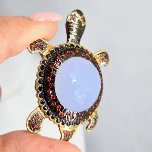 "Starry-Eyed, Flipper-Face!" Pendant/Brooch - Chalcedony, Garnet, Sapphire, Black Sterling, 18k Gold