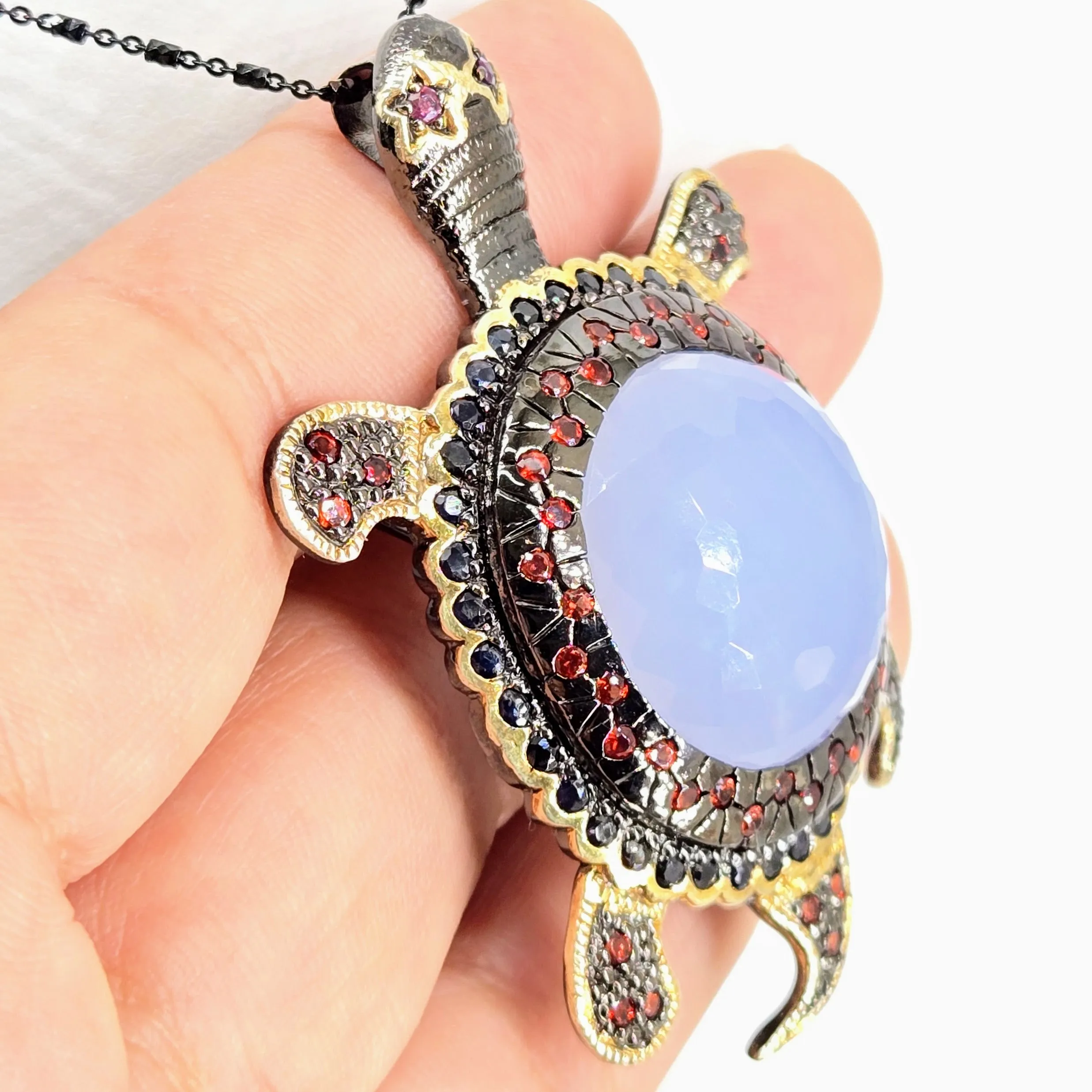 "Starry-Eyed, Flipper-Face!" Pendant/Brooch - Chalcedony, Garnet, Sapphire, Black Sterling, 18k Gold