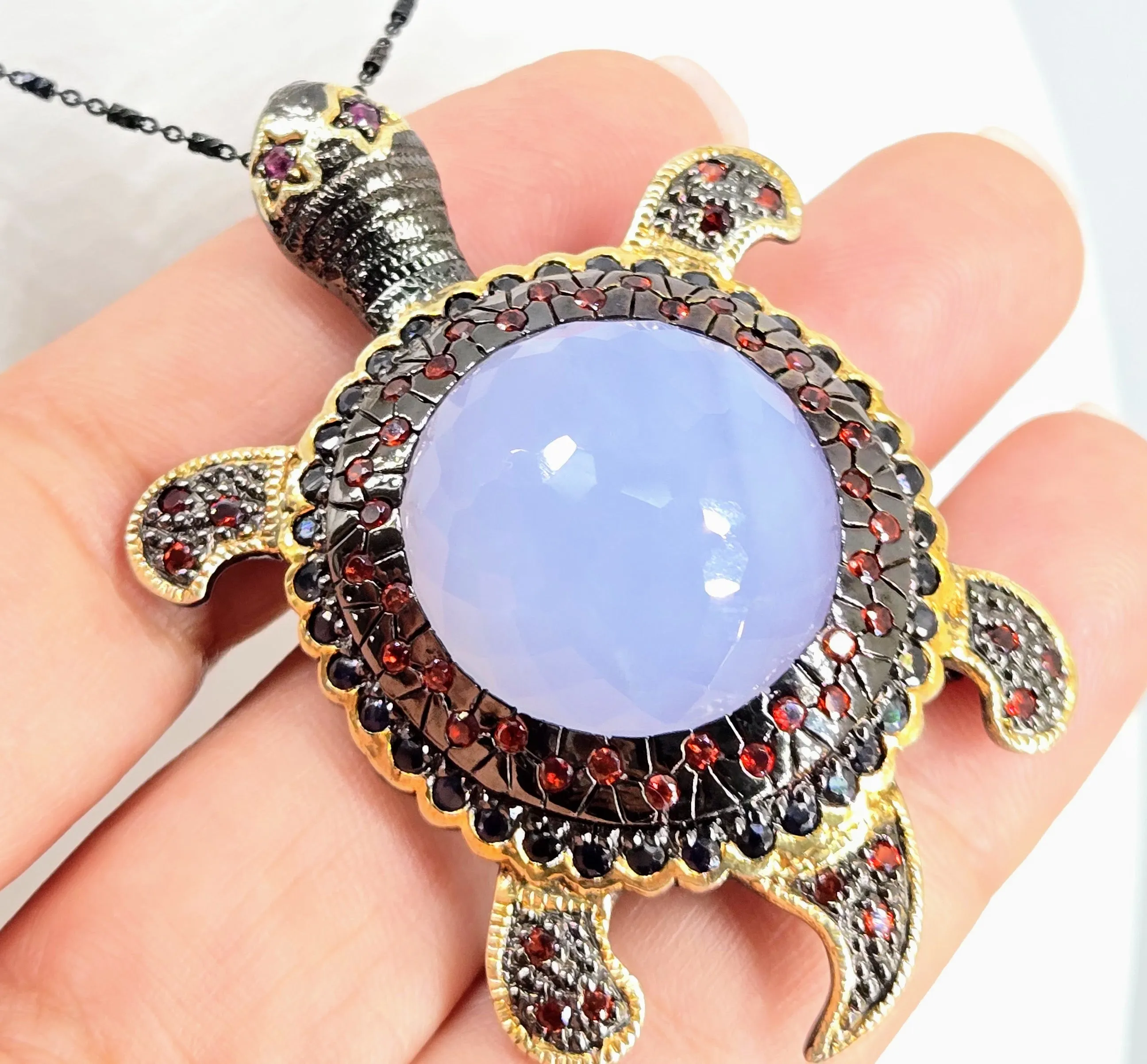"Starry-Eyed, Flipper-Face!" Pendant/Brooch - Chalcedony, Garnet, Sapphire, Black Sterling, 18k Gold