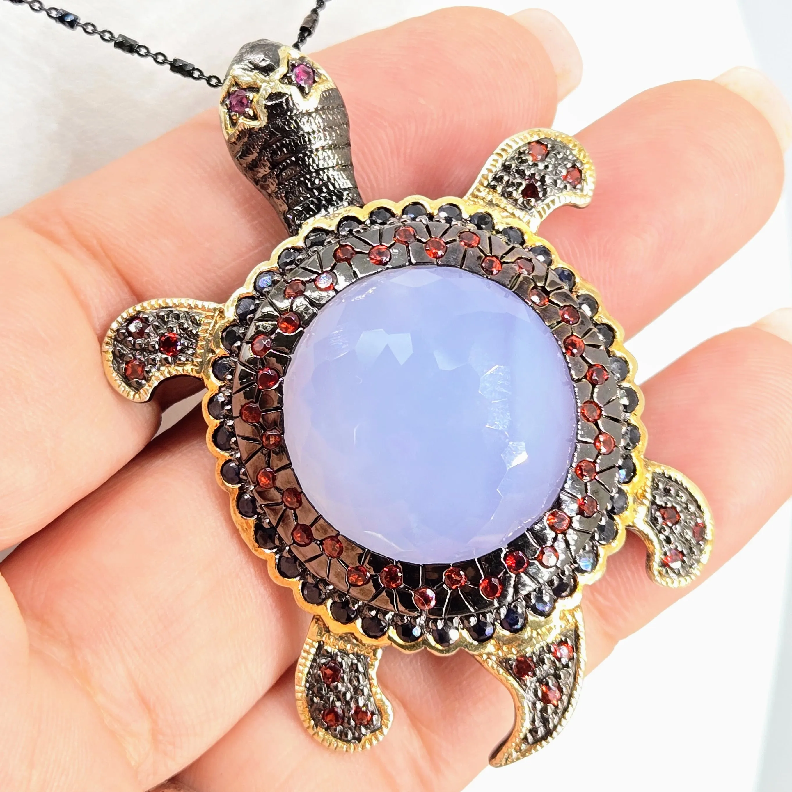 "Starry-Eyed, Flipper-Face!" Pendant/Brooch - Chalcedony, Garnet, Sapphire, Black Sterling, 18k Gold
